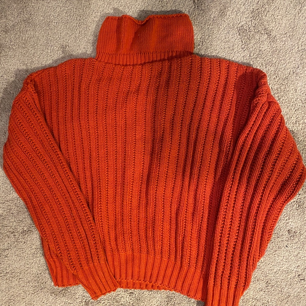 Orange turtleneck sweater
